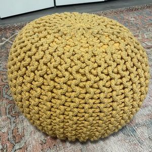 Poof as foot rest or seat